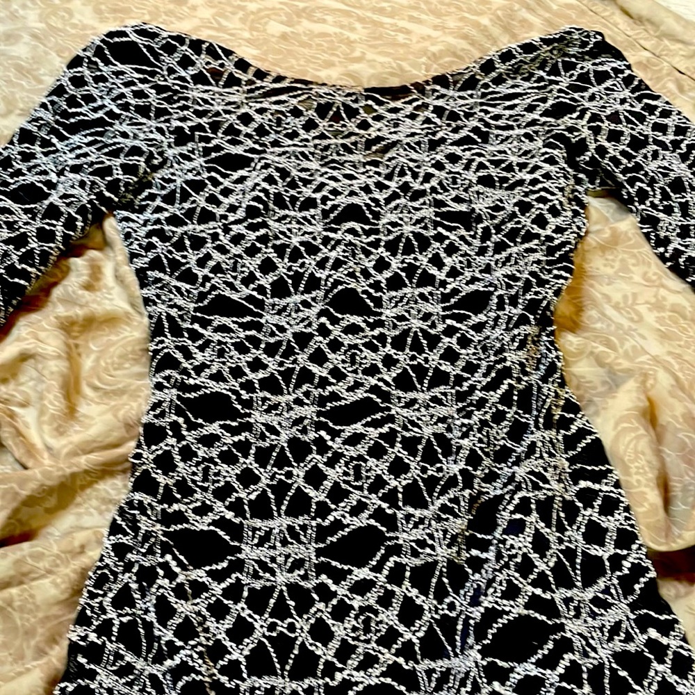 Mesh patterned dress with black dress underneath body con.